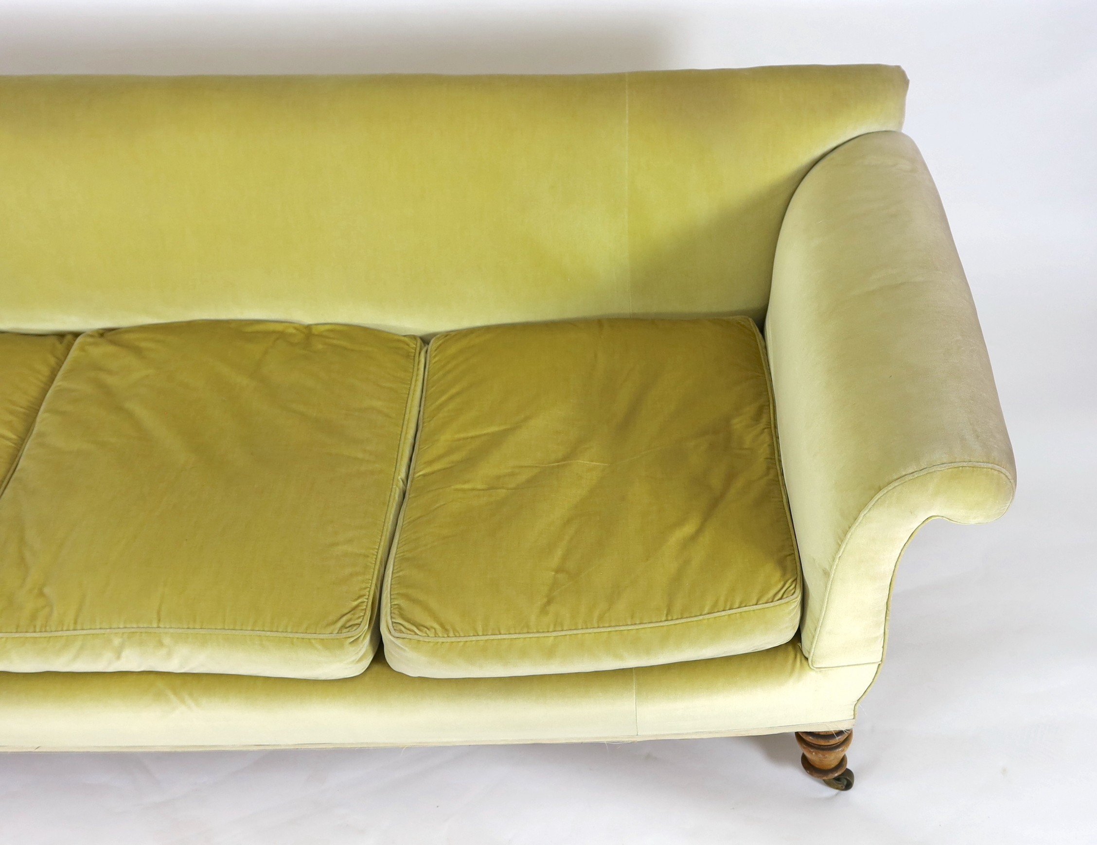 A large Victorian style sofa in the manner of Howard & Sons, 240cm wide, 92cm deep, 85cm high